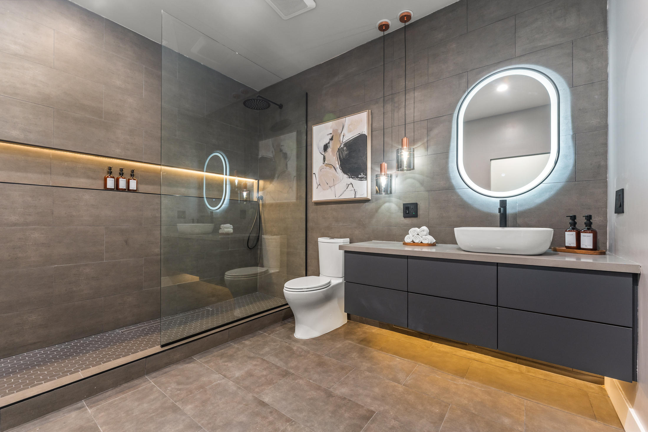 Bathroom with vessel sink and walk-in glass shower