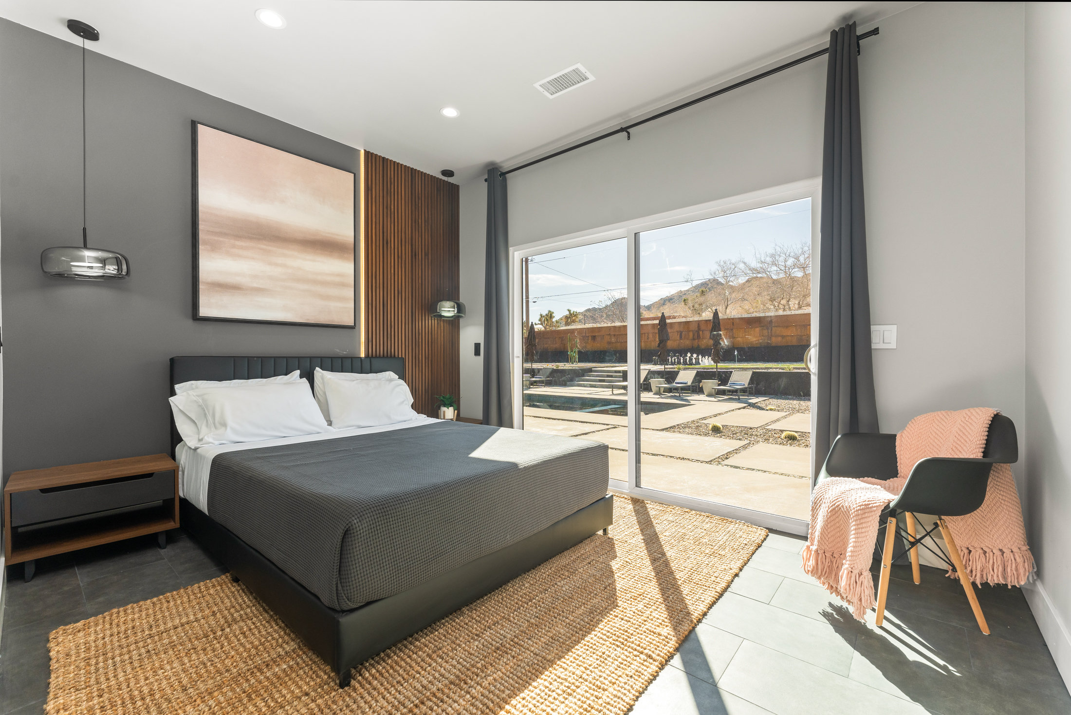 Bedroom with desert view through sliding glass doors