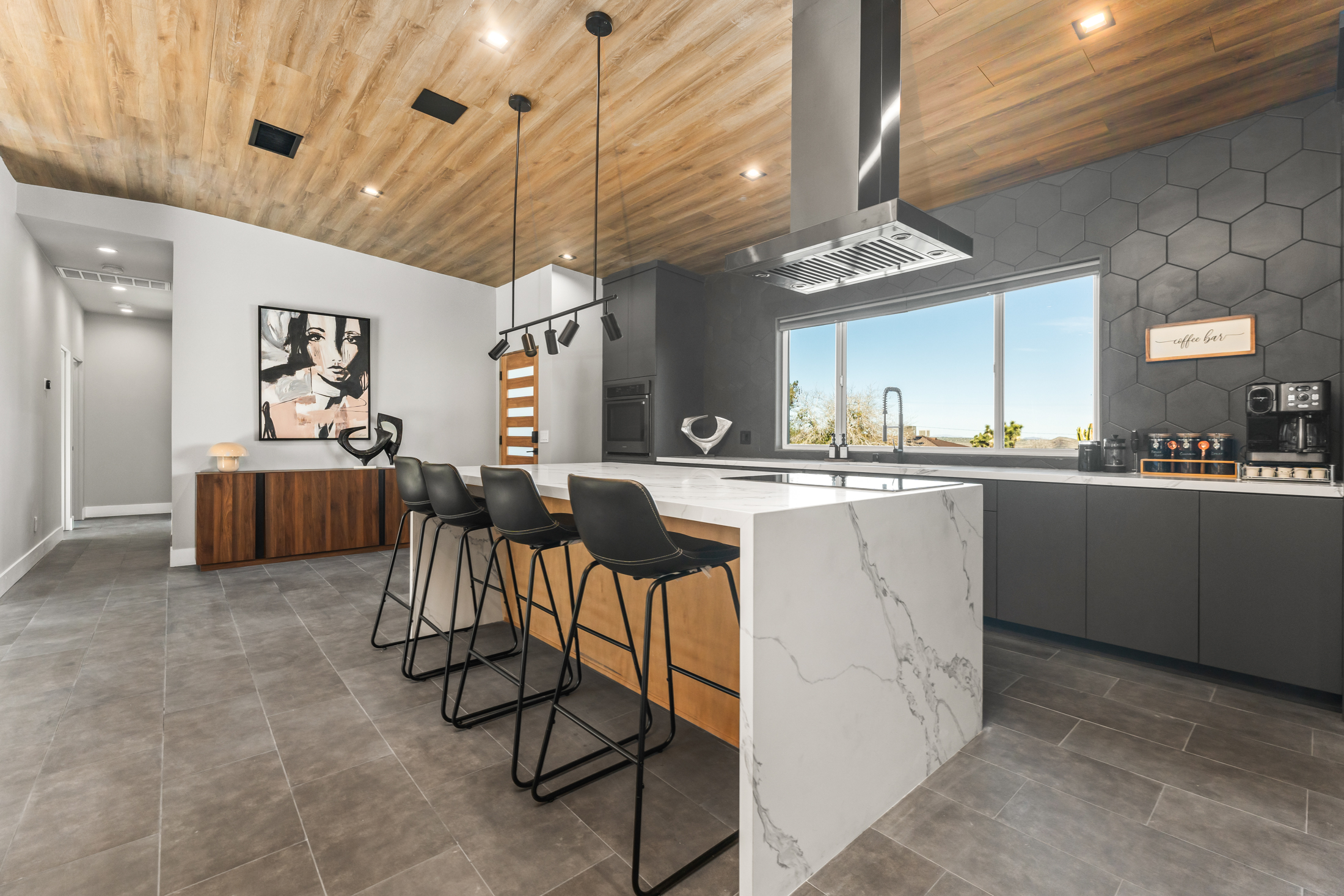 Kitchen with waterfall island and coffee bar