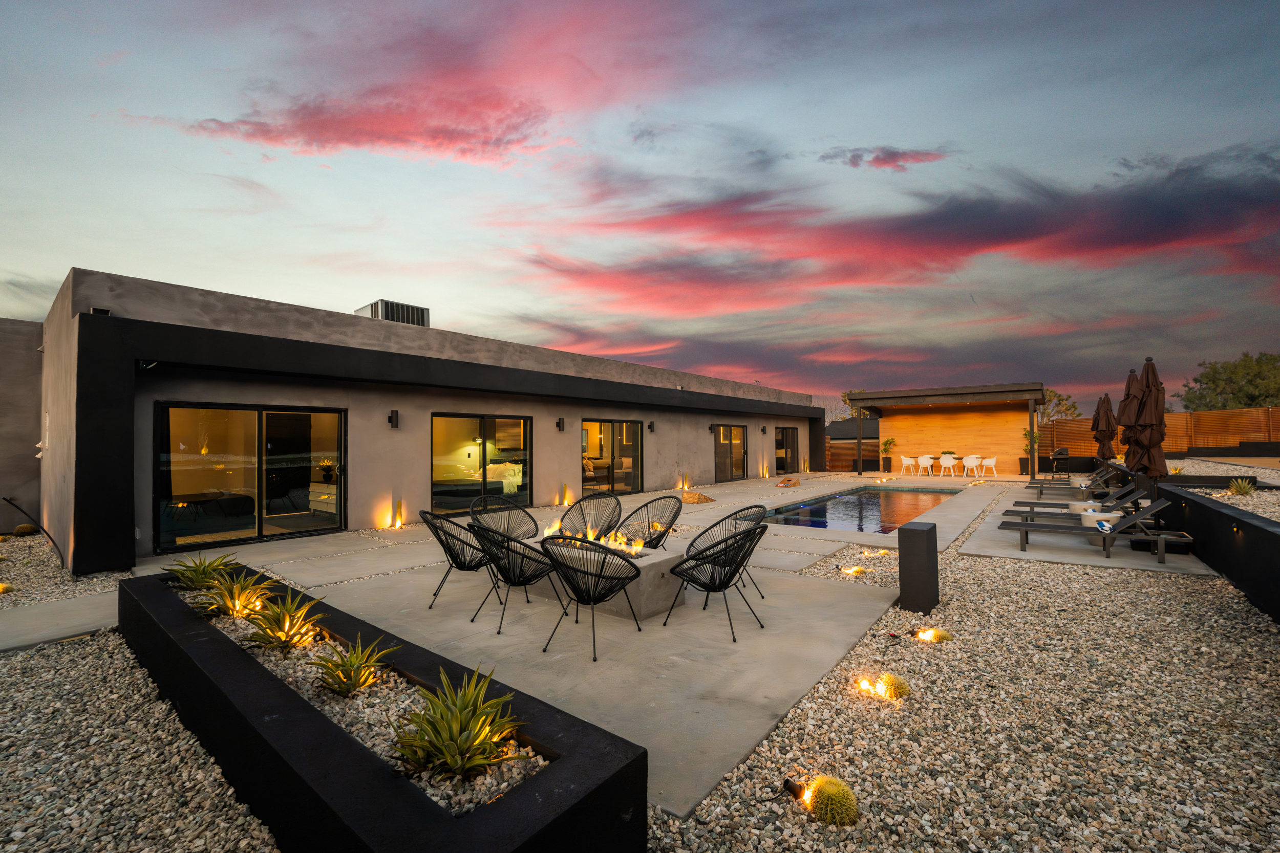 Pool and fire pit lounge at dusk